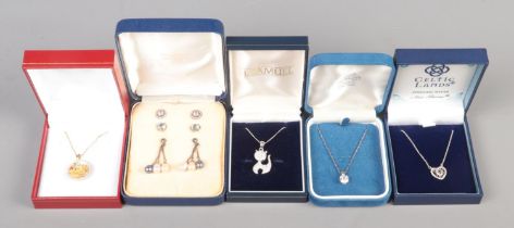 A quantity of silver jewellery, in boxes. To include earrings, necklaces and pendants on chains.