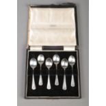 A cased set of six silver coffee spoons, with floral handles. Assayed for London, 1938 by Enid