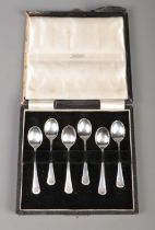 A cased set of six silver coffee spoons, with floral handles. Assayed for London, 1938 by Enid