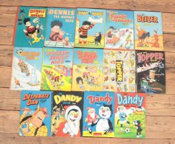 A collection of children's annuals. Includes Dennis the Menace (1958 edition), Dandy, Topper (1957