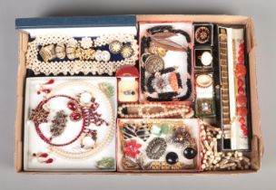 A tray of costume jewellery, containing vintage examples. Includes Fero watch ring, gate bracelet,