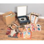 A Fidelity portable record players along with two boxes of singles and LP records. Includes mostly