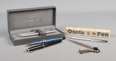 A collection of pens and pencils, to include Parker Junior fountain pen with 14ct Gold nib.