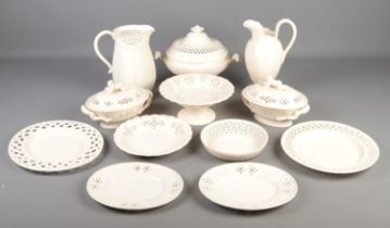 A large collection of Royal Creamware including Tureens, jugs, cake stand and various size plates.