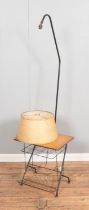 A French floor lamp featuring small built in side table. Screw missing on light fitting to hold