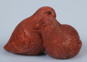 A Japanese carved Netsuke in the form of two sweet birds