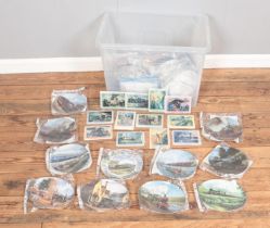A box containing a large quantity of railway and steam engine cabinet plates and tiles. Includes