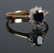 An 18ct Gold, Sapphire and Diamond cluster ring. Size K. Total weight: 2.4g