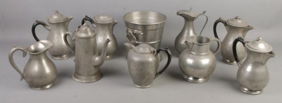 A quantity of pewter. Includes twin handled ice bucket, jugs, teapots, etc.