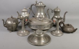 A quantity of metalware. Includes pair of pewter chamber candlestick with scrolling handles,