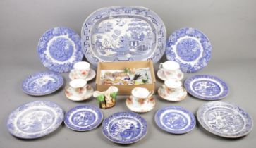 A box of miscellaneous. Includes large blue & white meat plate, glass & ceramic animals, cups &
