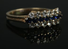 A 9ct Gold three row dress ring set with paste and sapphire coloured stones. Size NÂ½. Total weight: