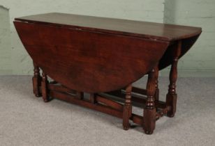 An oak wake table in the manner of Titchmarsh & Goodwin. (74cm x 167cm x 154cm)