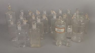 A good collection of vintage 20th century chemist bottles to include example with label and one