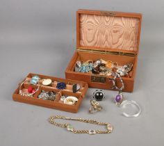 A jewellery box with contents of assorted costume jewellery to include Pilgrim, Ikita, various
