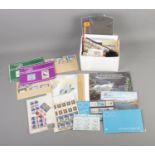 A collection of unused postage stamps including Royal Mint, Guernsey, Irish, and Isle of Man