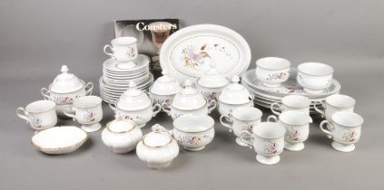 A collection of Denby dinner wares in the Lorraine pattern along with small quantity of Royal Albert