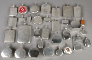 A box of pewter hipflask and scent bottles.