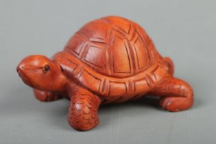 A Japanese carved Netsuke in the form of a tortoise