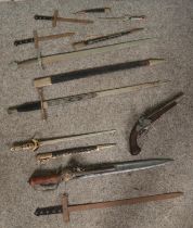 A quantity of swords and daggers along with a replica blunderbuss. Swords includes Toledo, Alfonso X