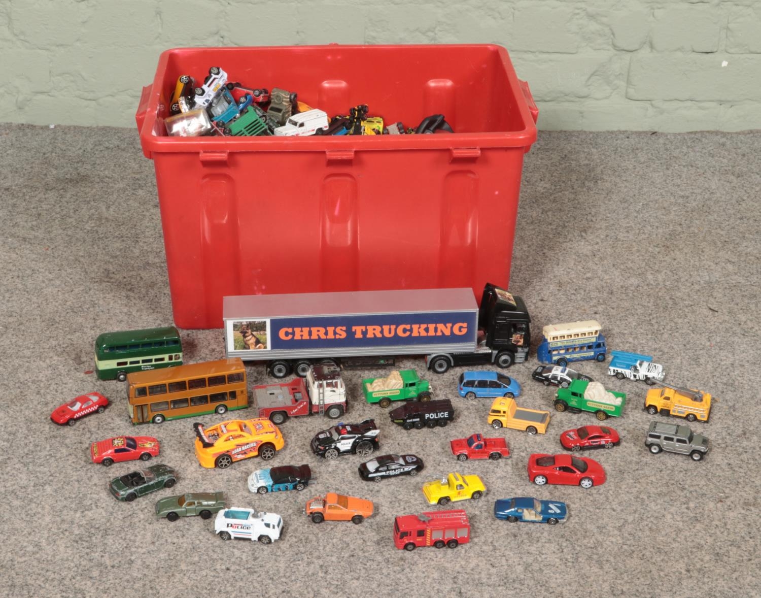 A box of diecast and other model vehicles including Corgi, Matchbox and Realtoy examples.