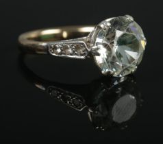 A 9ct Gold dress ring with large central stone flanked by three smaller stones. Size M. Total