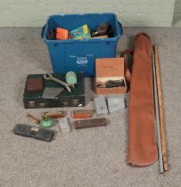 A box of assorted tools to include spirit levels, drill bits, wrenches, etc.