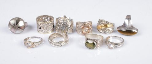 A collection of ten silver rings to include mother of pearl, gemstone set and stacking examples.