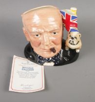 A Royal Doulton large character jug depicting Winston Churchill with bulldog and Union Jack. 1992