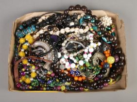 A box containing a good collection of beaded costume jewellery necklaces.