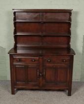 An Ercol dresser with dark stain finish