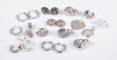 A collection of silver earrings, charms and pendants to include mother of pearl, rose and heart