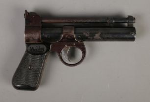 A Webley & Scott The Webley Junior .177 cal air pistol featuring chequered grips. CANNOT POST