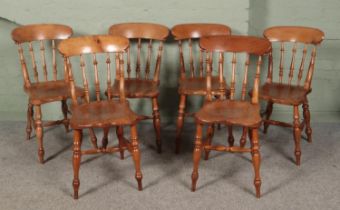 A set of six ash and elm spindle back kitchen chairs.