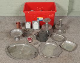 A large box of metalwares. Includes large trays, tankards, photo frames, teapots, jugs, etc.