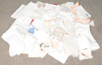 A large box of lace and linen. Includes embroided examples.