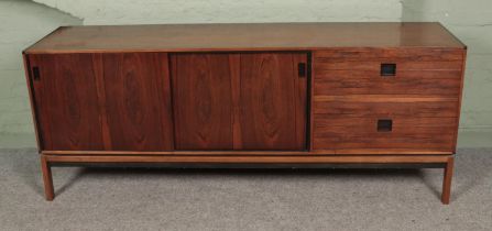 A large retro sideboard featuring four drawers and two sliding doors. Approx. dimensions 192cm x