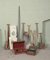 A collection of assorted tools to include boxed Viking hedge trimmer, sledgehammer, axe, shovel,