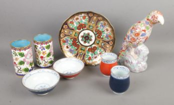 A collection of oriental ceramics to include Imari parrot, enamel and cloisonne brush pots, Noritake