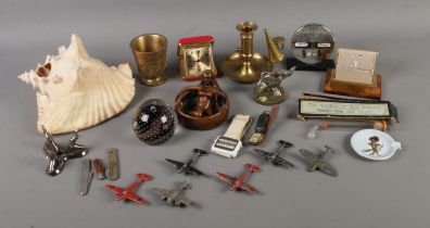 An assortment of collectables to include lead plane figures, conch shell, novelty ashtray, Caithness