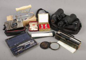A box of collectables. Includes tortoiseshell pocket mirror, Tasco binoculars, cased cloisonne