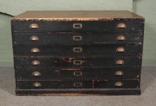 An early/mid 20th century plan chest in two sections with painted body and six fitted draws with