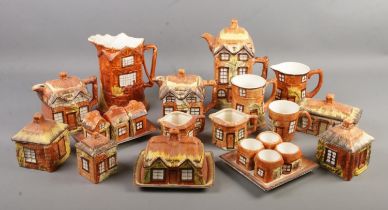 A quantity of cottageware ceramics. Includes tea pots, butter dish, cruet set, egg cups etc.