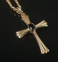A 9ct gold crucifix pendant on chain featuring central inset stone. Total weight 11.17g.