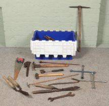 A box of tools. Includes pickaxe, axes, hammers, shears, etc.