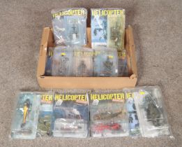 A collection of 9 Helicopter Magazine issues including model planes, all unopened.