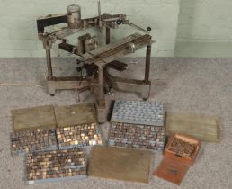 A Gravograph engraving machine along with a large quantity of matching brass lettering.