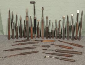 A quantity of large wood turning lathe tools.