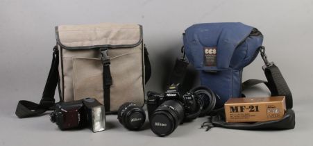 A Nikon F-801 camera, with Nikon Nikkor 70-210mm lens, together with accessory bag. Accessories