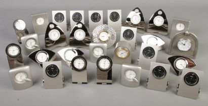 A box of miniature Zeitgeist quartz clocks.
